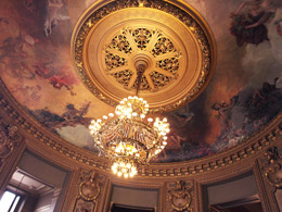 Photograph of the chandelier and painted ceiling of the Salon Glaicer in Paris’s Palais Garner. Photo by Danielle MacDonald