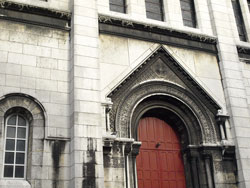Photograph of the red side door of the Basilique du Sacre-Coeur de Montmarte, Paris, France. Photo taken by Danielle MacDonald